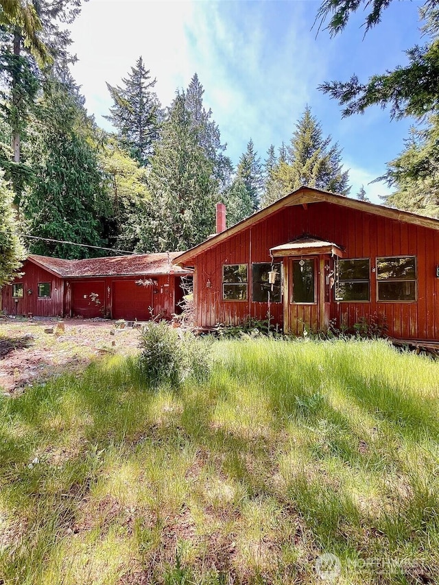 5072 View Rd, Langley, WA 98260 - view of front of property featuring a chimney and an attached garage