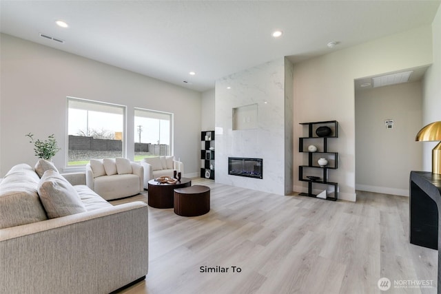 4246 W Sandy Ct, Moses Lake, WA 98837 - living room with wood finished floors, recessed lighting, and a fireplace