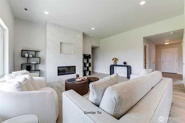 4246 W Sandy Ct, Moses Lake, WA 98837 - living area featuring light wood-style floors, a high end fireplace, and recessed lighting