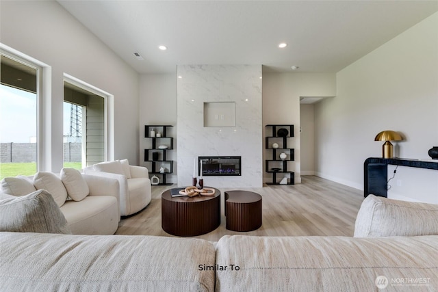 4246 W Sandy Ct, Moses Lake, WA 98837 - living room with light wood finished floors, a fireplace, and recessed lighting
