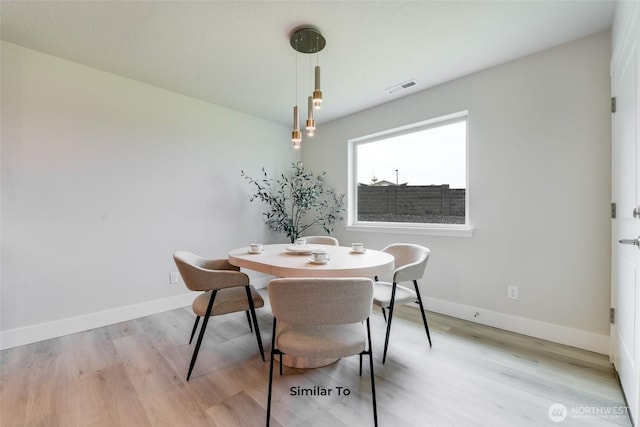 4246 W Sandy Ct, Moses Lake, WA 98837 - dining area with light wood-style floors and baseboards