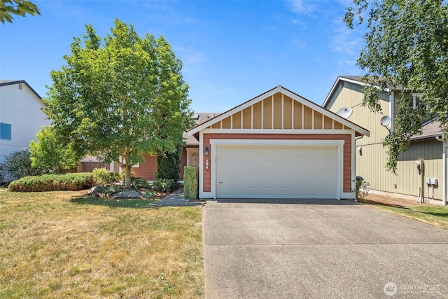 134 Wind River Dr, Chehalis, WA 98532 - view of front of house featuring a front yard, board and batten siding, driveway, and an attached garage