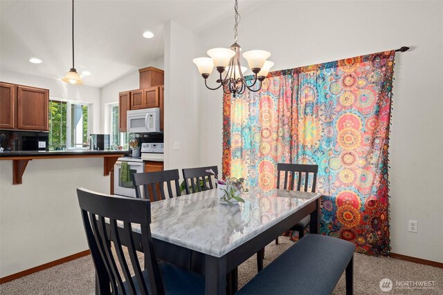 134 Wind River Dr, Chehalis, WA 98532 - dining space featuring light carpet, baseboards, a chandelier, recessed lighting, and vaulted ceiling