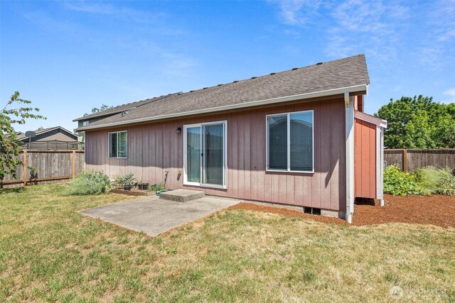 134 Wind River Dr, Chehalis, WA 98532 - back of property with a patio area and roof with shingles