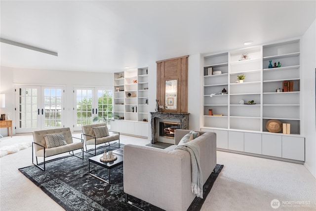 2053 Minor Ave E Unit 12, Seattle, WA 98102 - living area with built in shelves, carpet floors, a fireplace, and french doors