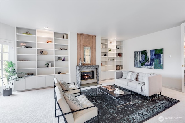 2053 Minor Ave E Unit 12, Seattle, WA 98102 - living area with carpet flooring, built in shelves, a high end fireplace, and recessed lighting