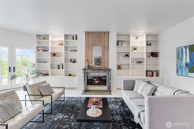 2053 Minor Ave E Unit 12, Seattle, WA 98102 - living room featuring built in features, a fireplace, and french doors
