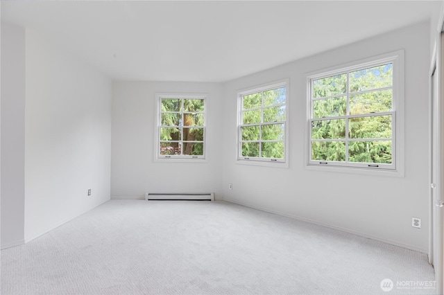 2053 Minor Ave E Unit 12, Seattle, WA 98102 - carpeted empty room featuring a baseboard heating unit
