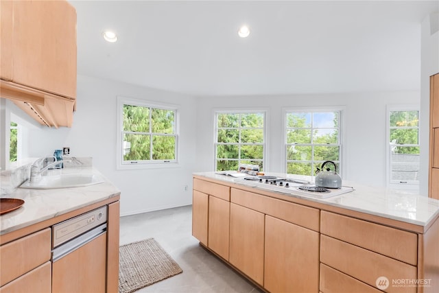 2053 Minor Ave E Unit 12, Seattle, WA 98102 - kitchen with light brown cabinetry, white stovetop, light stone counters, recessed lighting, and concrete flooring