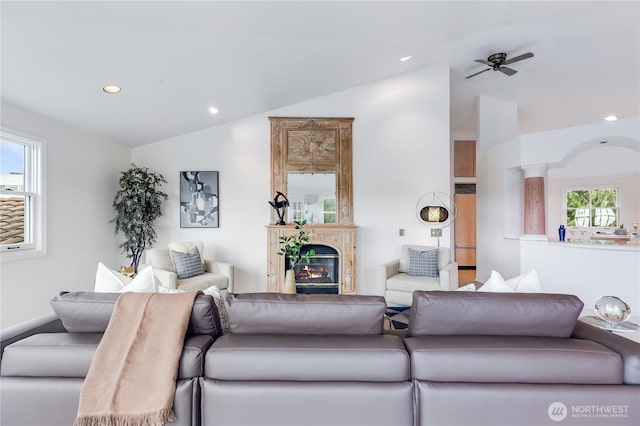 2053 Minor Ave E Unit 12, Seattle, WA 98102 - living area featuring vaulted ceiling, recessed lighting, a glass covered fireplace, and ceiling fan