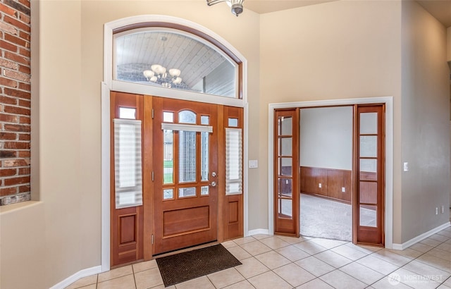 17713 92nd Ave E, Puyallup, WA 98375 - entryway with light tile patterned floors, a chandelier, and light carpet