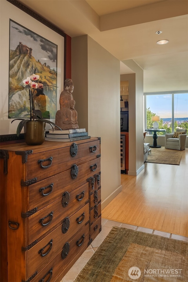 2000 1st Ave Unit 804, Seattle, WA 98121 - corridor featuring beverage cooler, light wood-type flooring, and expansive windows