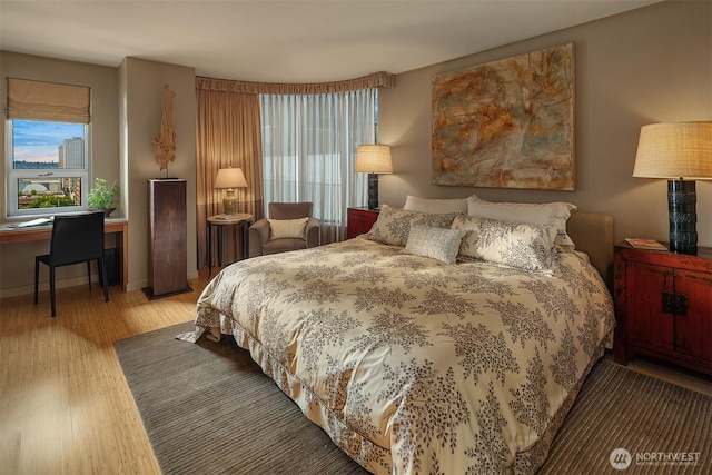 2000 1st Ave Unit 804, Seattle, WA 98121 - bedroom featuring wood finished floors and a desk