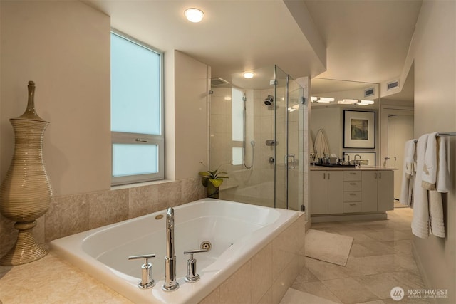 2000 1st Ave Unit 804, Seattle, WA 98121 - bathroom with vanity, a stall shower, a whirlpool tub, and tile patterned flooring