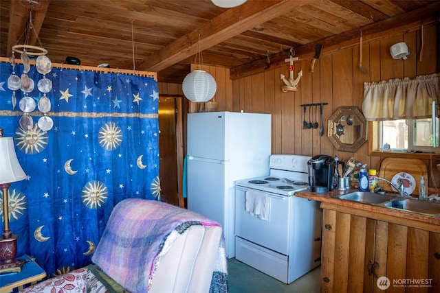 450 Olympus Blvd, Port Ludlow, WA 98365 - kitchen featuring white appliances, a sink, wood ceiling with exposed beams, wood walls, and concrete flooring