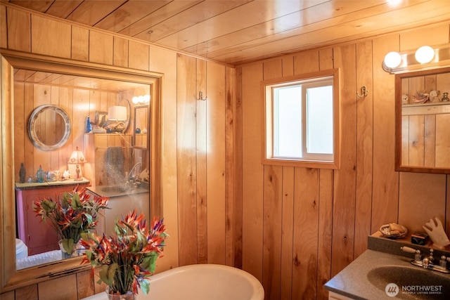 450 Olympus Blvd, Port Ludlow, WA 98365 - bathroom with wood walls, vanity, and wooden ceiling
