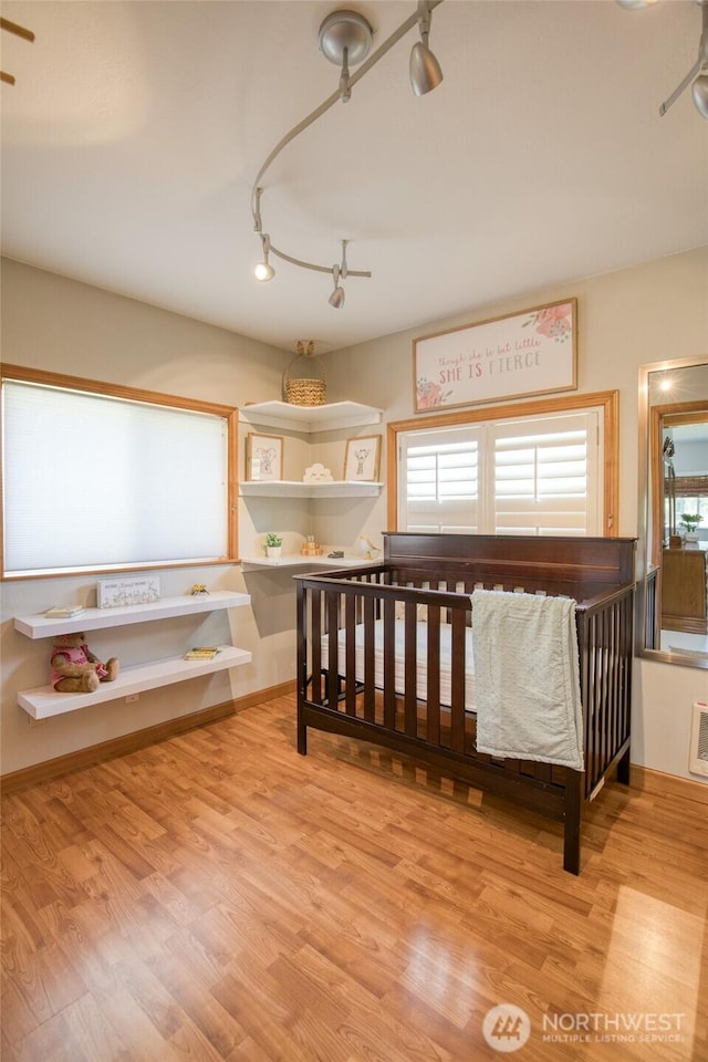 2685 E Hoquiam Rd, Hoquiam, WA 98550 - bedroom with track lighting and wood finished floors
