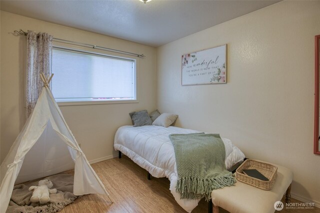 2685 E Hoquiam Rd, Hoquiam, WA 98550 - bedroom with baseboards and wood finished floors