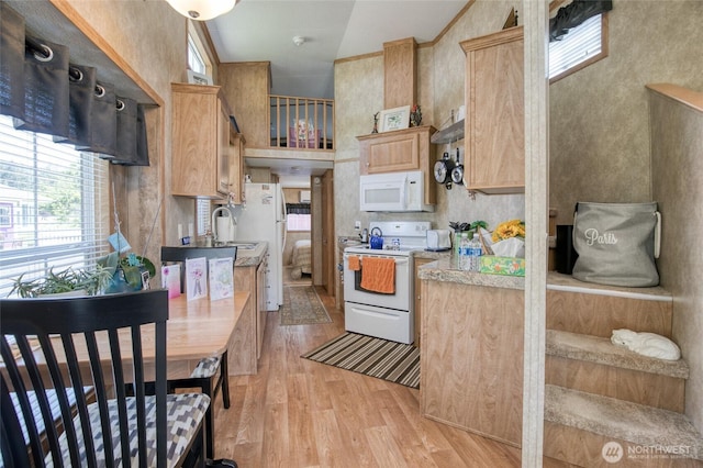 2685 E Hoquiam Rd, Hoquiam, WA 98550 - kitchen with white appliances, light wood-style flooring, light brown cabinetry, light countertops, and a sink