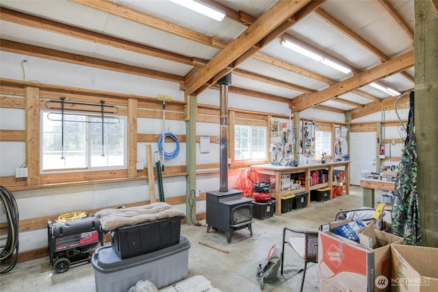 2685 E Hoquiam Rd, Hoquiam, WA 98550 - misc room with unfinished concrete flooring and a wood stove