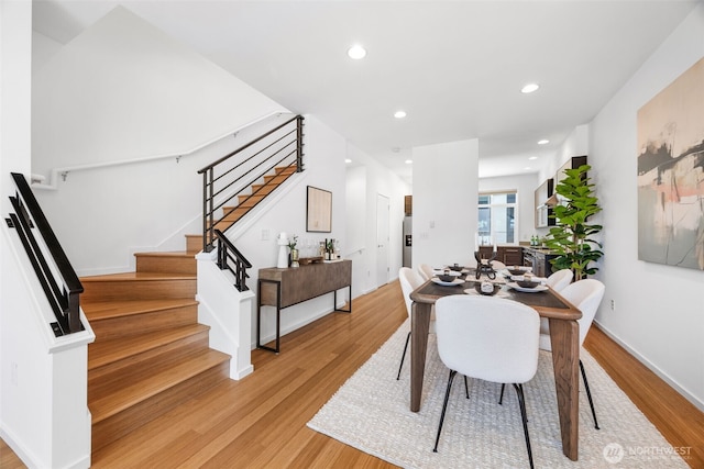 203 20th Ave E, Seattle, WA 98112 - dining room featuring light wood-style floors, stairs, recessed lighting, and baseboards