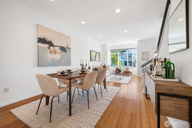 203 20th Ave E, Seattle, WA 98112 - dining area with light wood-type flooring, recessed lighting, baseboards, and stairway