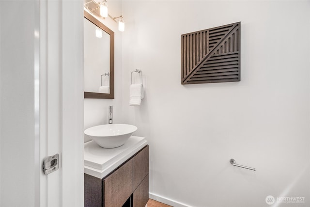 203 20th Ave E, Seattle, WA 98112 - bathroom with vanity and baseboards