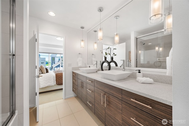 203 20th Ave E, Seattle, WA 98112 - ensuite bathroom featuring double vanity, tile patterned flooring, and an enclosed shower