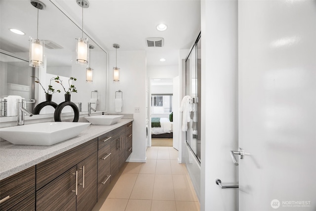 203 20th Ave E, Seattle, WA 98112 - full bathroom featuring double vanity, tile patterned flooring, an enclosed shower, ensuite bath, and recessed lighting