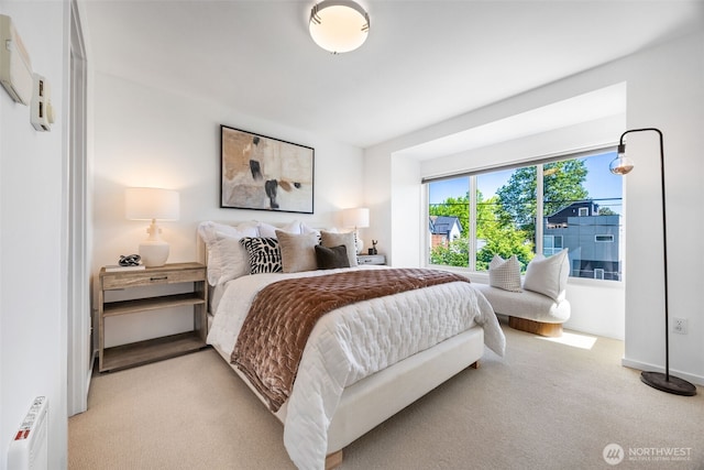 203 20th Ave E, Seattle, WA 98112 - bedroom featuring radiator heating unit and light carpet