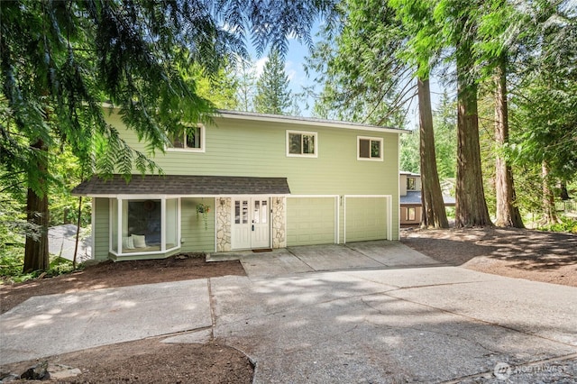 415 Sudden Valley Dr, Bellingham, WA 98229 - view of front of property featuring an attached garage, driveway, and a shingled roof
