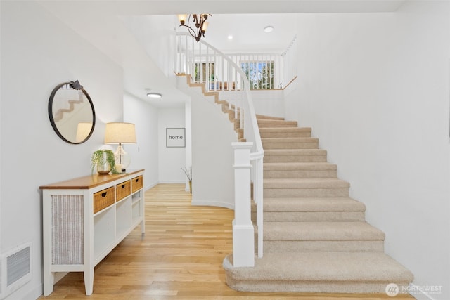 415 Sudden Valley Dr, Bellingham, WA 98229 - stairs featuring wood finished floors and a chandelier