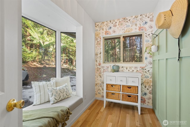 415 Sudden Valley Dr, Bellingham, WA 98229 - living area with wallpapered walls, wood finished floors, and baseboards