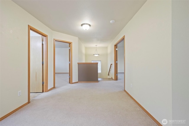 4109 Shale St SE, Lacey, WA 98503 - hall featuring an upstairs landing, carpet, and baseboards