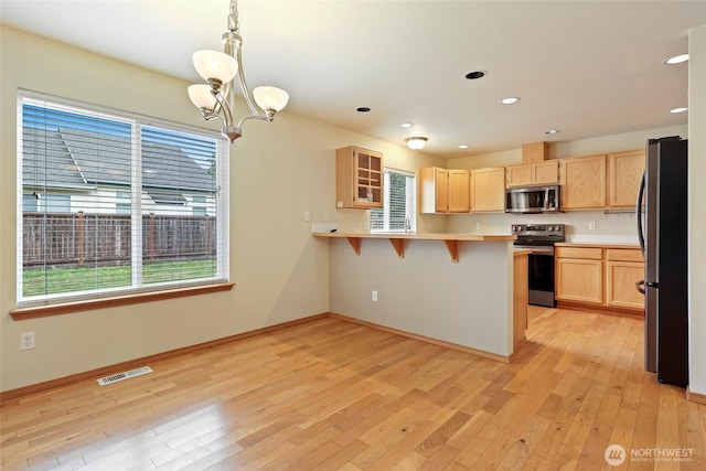 4109 Shale St SE, Lacey, WA 98503 - kitchen featuring appliances with stainless steel finishes, light brown cabinetry, plenty of natural light, and recessed lighting