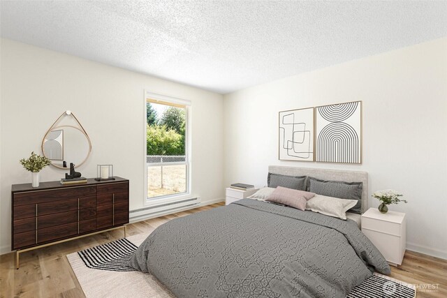 10405 12th Avenue Ct S, Tacoma, WA 98444 - bedroom featuring baseboard heating, wood finished floors, and a textured ceiling