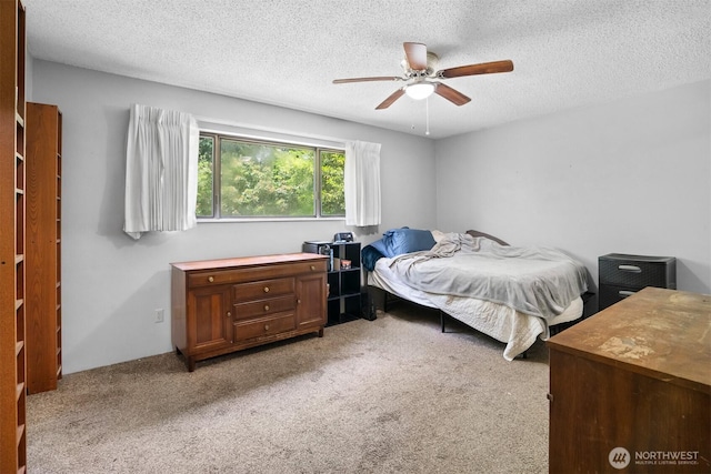 209 Old Hill Rd, Aberdeen, WA 98520 - bedroom with a textured ceiling, light carpet, and ceiling fan