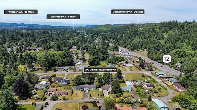 209 Old Hill Rd, Aberdeen, WA 98520 - aerial overview of property's location featuring a heavily wooded area and nearby suburban area