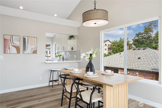 9422 49th Ave S, Seattle, WA 98118 - dining area with light wood-style floors, recessed lighting, and high vaulted ceiling