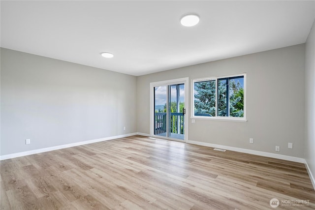 9422 49th Ave S, Seattle, WA 98118 - empty room featuring baseboards and light wood-type flooring