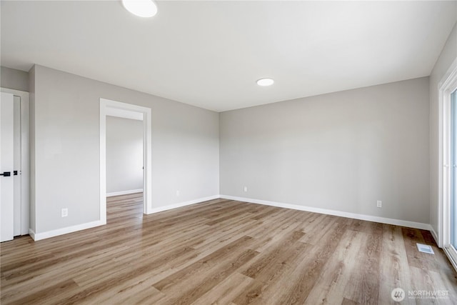 9422 49th Ave S, Seattle, WA 98118 - spare room featuring light wood-style flooring and baseboards