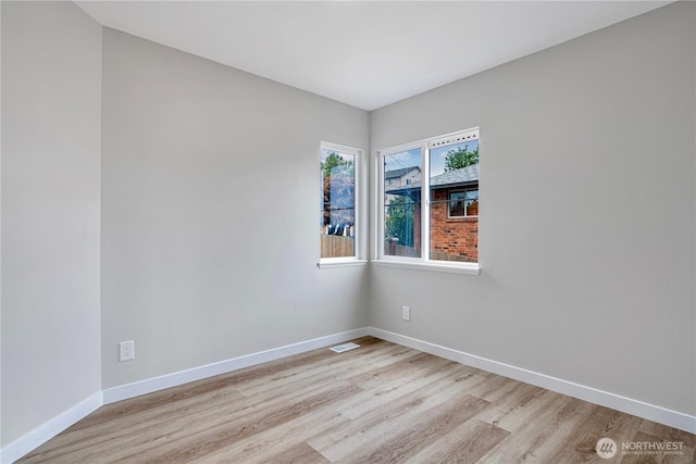 9422 49th Ave S, Seattle, WA 98118 - empty room with light wood finished floors and baseboards