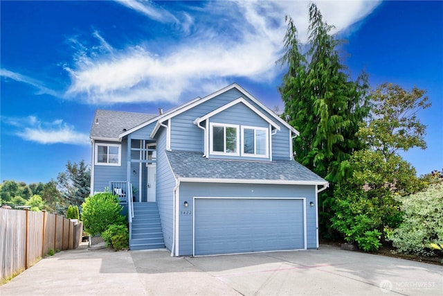 9422 49th Ave S, Seattle, WA 98118 - view of front of property with a garage, concrete driveway, and a shingled roof