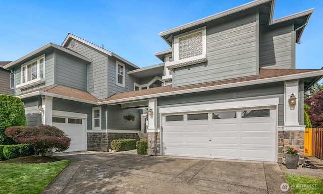 27638 246th Ave SE, Maple Valley, WA 98038 - view of front facade featuring an attached garage, driveway, stone siding, and roof with shingles