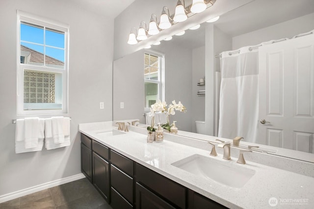 27638 246th Ave SE, Maple Valley, WA 98038 - bathroom featuring double vanity, plenty of natural light, and tile patterned floors