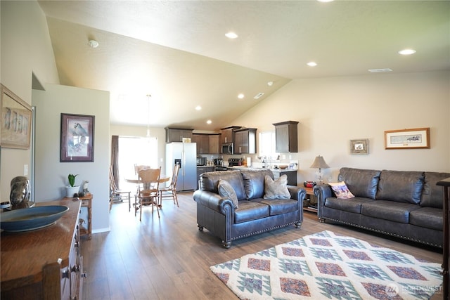 1028 W Sequoia Rd, Moses Lake, WA 98837 - living room with wood finished floors, recessed lighting, and high vaulted ceiling