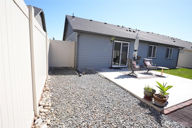 1028 W Sequoia Rd, Moses Lake, WA 98837 - rear view of property with a patio area and a shingled roof