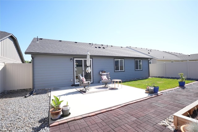 1028 W Sequoia Rd, Moses Lake, WA 98837 - rear view of house featuring a patio and roof with shingles