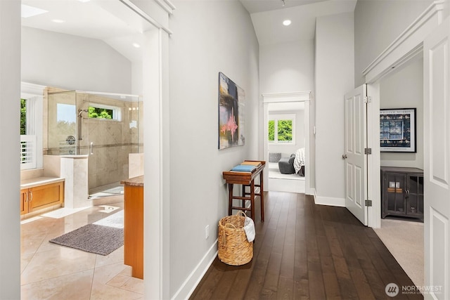 8418SE 44th St, Mercer Island, WA 98040 - hall featuring baseboards, recessed lighting, hardwood / wood-style floors, and a towering ceiling