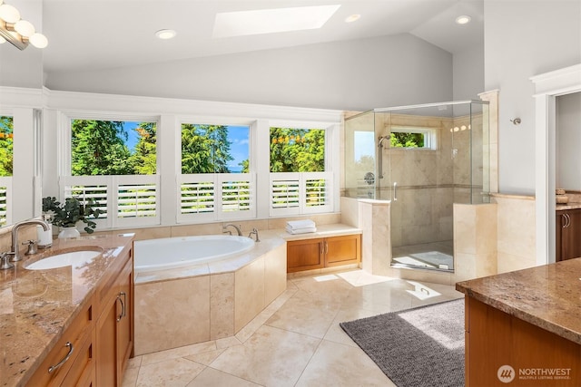8418SE 44th St, Mercer Island, WA 98040 - full bathroom featuring a skylight, a stall shower, a bath, vanity, and recessed lighting